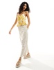 ASOS DESIGN shirred peplum cami sun top in yellow floral print