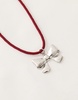 Reclaimed Vintage necklace with bow pendant on red cord