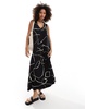 ASOS DESIGN sleeveless trapeze maxi with D-ring back detail in black print