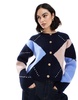ASOS DESIGN knitted crew neck cardigan with gold button in navy argyle pattern