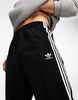 adidas Originals Adicolor firebird track pants in black & white