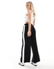 ASOS DESIGN Petite pull-on pants with contrast panel in black