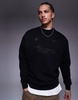 ASOS DESIGN oversized sweatshirt with metallic prints in black