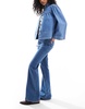 ASOS DESIGN super high waist flared jeans in mid blue