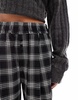 Bershka Petite tie waist wide leg pants in black check