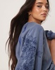 ASOS DESIGN oversized sweat with seam detail and cutwork sleeves in washed blue