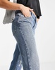 ASOS DESIGN Petite cotton blend low rise straight leg jeans in all over diamante hotfix with ripped knee - MBLUE