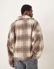 ASOS DESIGN extreme oversized boxy sweater with funnel neck in brown plaid