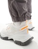 ASOS DESIGN chunky knit sneakers in white and orange