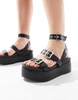 ASOS DESIGN Wide Fit Trombone chunky buckle detail flatforms in black