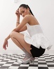 Amy Lynn shirred peplum cami top in white