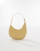 ASOS DESIGN asymmetric scoop shoulder bag with buckle detail in buttermilk