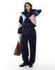 ASOS DESIGN knitted crew neck cardigan with gold button in navy argyle pattern