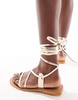 ASOS DESIGN Finland leather strappy toe-loop flat sandals in gold
