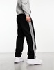 adidas Originals Adicolor firebird track pants in black & white