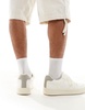 Bershka lace up sneakers with back tab in white