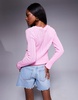 ASOS DESIGN knit tie front cardigan with red tipping detail in pink