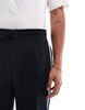 ASOS DESIGN straight leg sweatpants with textured side stripes in black