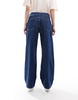 ASOS DESIGN slouchy wide leg jeans in mid blue