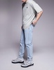 ASOS DESIGN tapered fit jeans in light wash blue