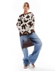 ASOS DESIGN fluffy knitted sweater in cow print