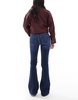 Bershka Petite high rise flared jeans in dark wash