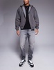 ASOS DESIGN tapered fit jeans in washed black