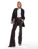 Bershka faux leather flared pants in brown