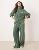 ASOS DESIGN lounge microfleece zip collar sweat & wide leg set in khaki with contrast trim