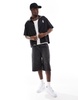 Bershka sports tipped collar shirt in black