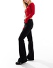Bershka Petite high waisted flared jeans in black