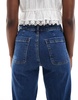 Bershka high waisted pocket detail jeans in mid wash