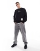 Bershka sweatshirt with feather graphic in black