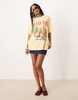 ASOS DESIGN oversized slubby t-shirt with rio de janeiro fruit graphic in yellow