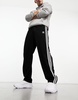 adidas Originals Adicolor firebird track pants in black & white