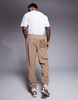 ASOS DESIGN tapered fleece sweatpants in brown