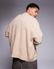 ASOS DESIGN oversized boxy fit knit crew neck cardigan with pockets in beige