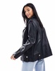 River Island petite faux leather oversized biker jacket in black