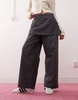 Reclaimed Vintage mini skirt over pants in gray