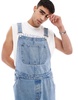ASOS DESIGN oversized denim overalls in mid wash blue