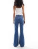 ASOS DESIGN super high waist flared jeans in mid blue