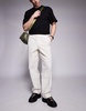 ASOS DESIGN baggy fit pants with workwear patch in ecru