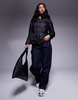 Armani Exchange padded coat with all over logo print in black