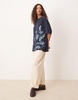 ASOS DESIGN oversized T-shirt with tonal floral graphic in navy
