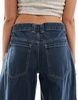 Bershka baggy balloon leg jeans in dark blue