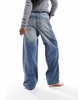 Bershka high waisted super baggy jeans in mid blue dirty wash