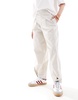 ASOS DESIGN tapered pants with tab hem detail in stone - part of a set