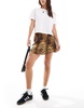 ASOS DESIGN wrap satin mini skirt in animal print