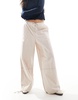 ASOS DESIGN pants with tie hems and clean utility pockets in stone