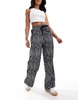 ASOS DESIGN pull-on pants with contrast panel in mono animal print